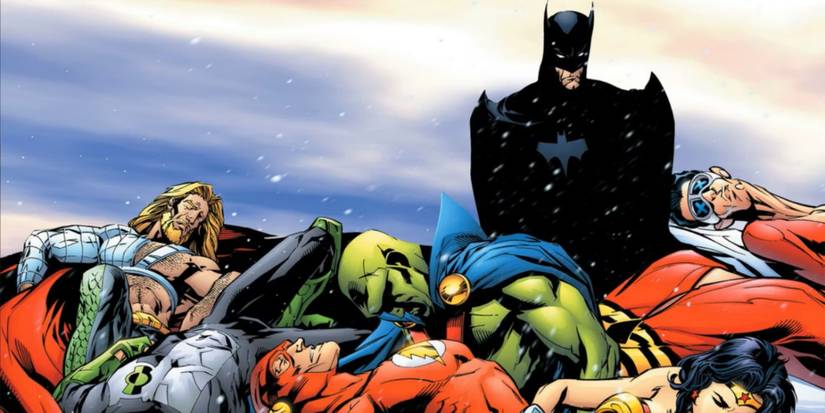 Batman standing over the defeated members of the Justice League in DC Comics