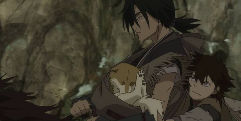 The ranger swordsman Nanashi holding a dog named Tobimaru while a boy, Kotaro, glares in Sword of the Stranger.