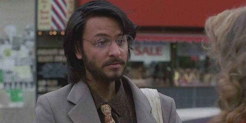 Ben Jabituya talking to a woman in Short Circuit. 