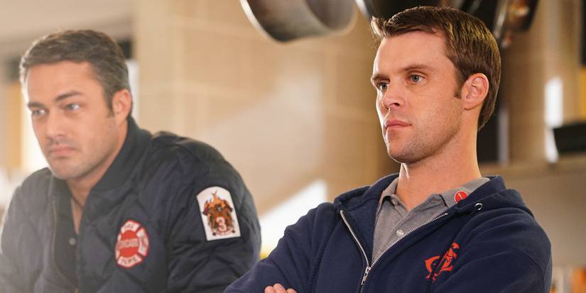 Chicago Fire's Kelly Severide (played by Taylor Kinney) and Matthew Casey (Jesse Spencer) stand next to each other in Firehouse 51.