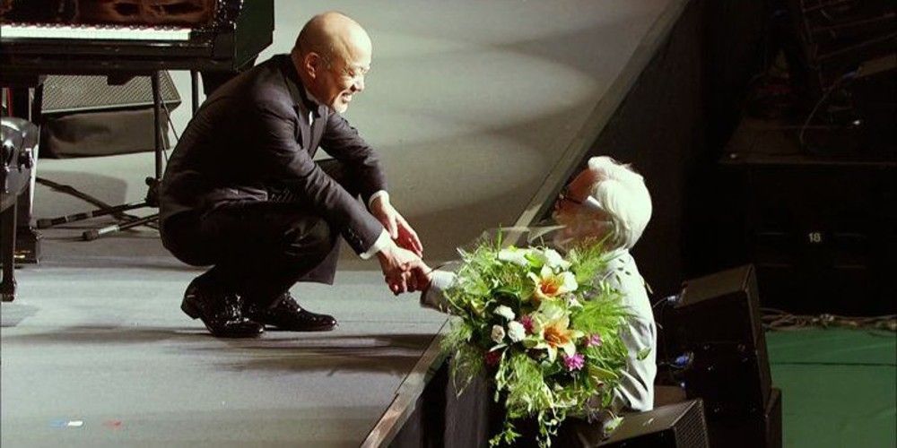 Hayao Miyazaki shakes hands with Joa Hisaishi