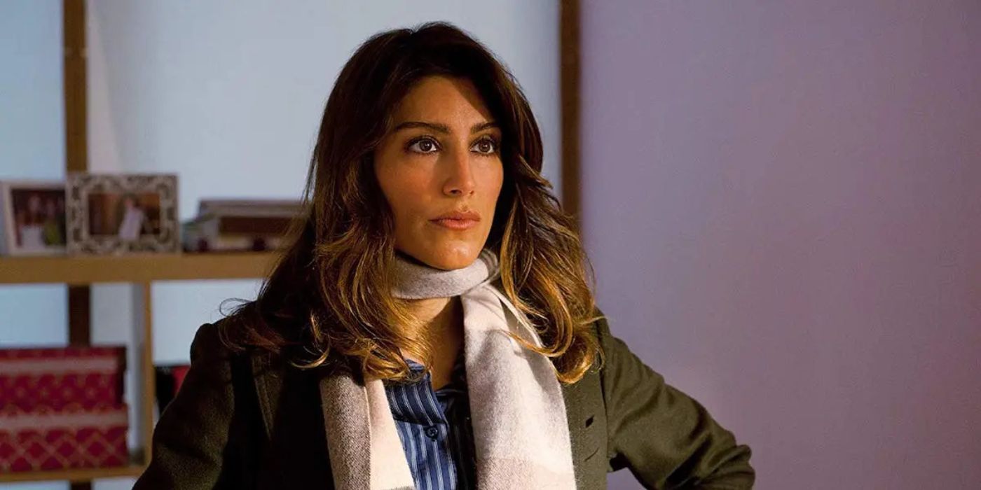 Jennifer Esposito sits in an office as Detective Jackie Curatola in CBS's Blue Bloods