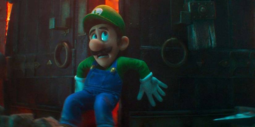 Luigi holding a door closed in The Super Mario. Bros. Movie.