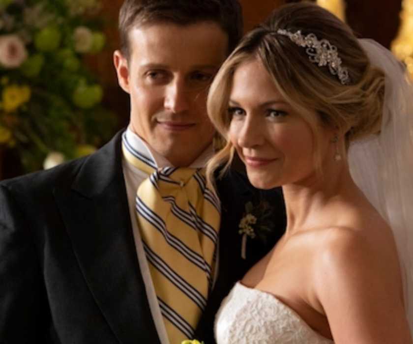 Eddie and Jamie stand in their wedding attire at the altar Blue Bloods season 9