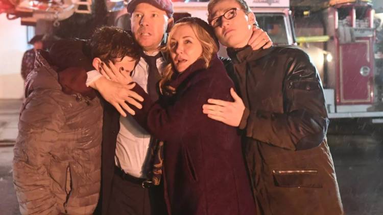 Danny and his family huddle together after an explosion in Blue Bloods.
