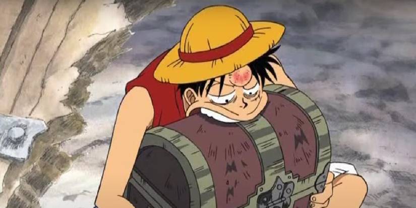 Luffy de One Piece grignote un coffre au trésor.