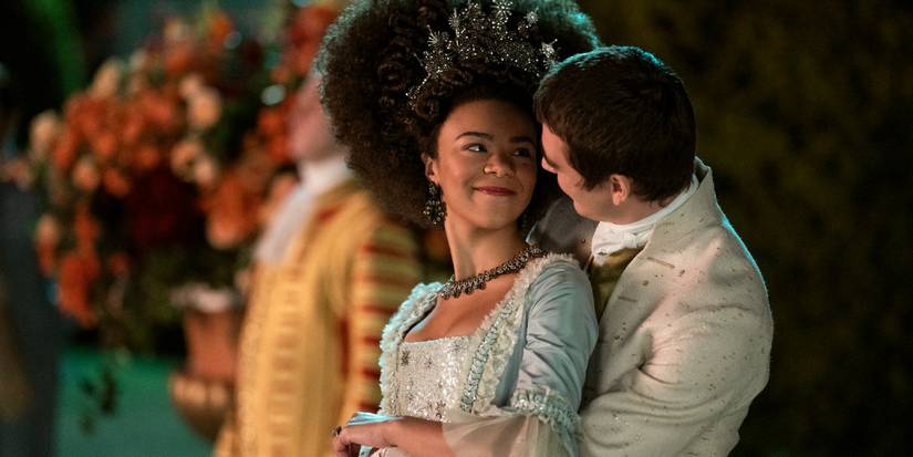 Queen Charlotte and King George smiling at each other in Queen Charlotte Season 1, Episode 6