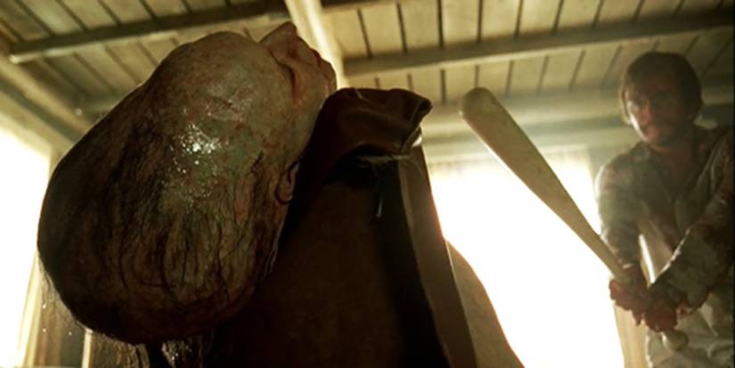 A survivor targets a baseball bat on a hill has mutant eyes 