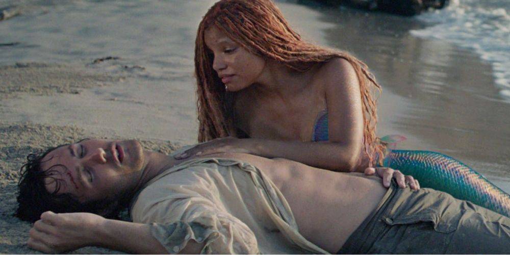 Ariel is singing to Prince Eric after she pulled him to the shore in Disney The Little Mermaid 2023