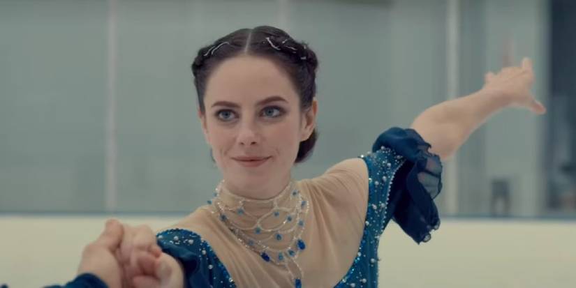 Kat Baker (Kaya Scodelario) smiles while skating with Justin during Spinning Out.