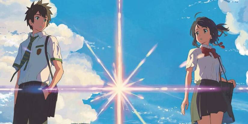 Taki and Mitsuha see each other in Your Name with a shooting star between them.