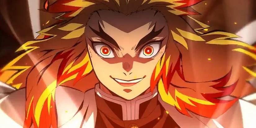 A closeup shows Kyojuro Rengoku smiling as he's about to fight in Demon Slayer.