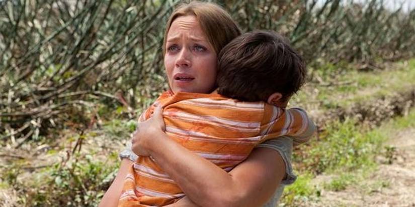 Sara and her son hug each other tightly in Looper
