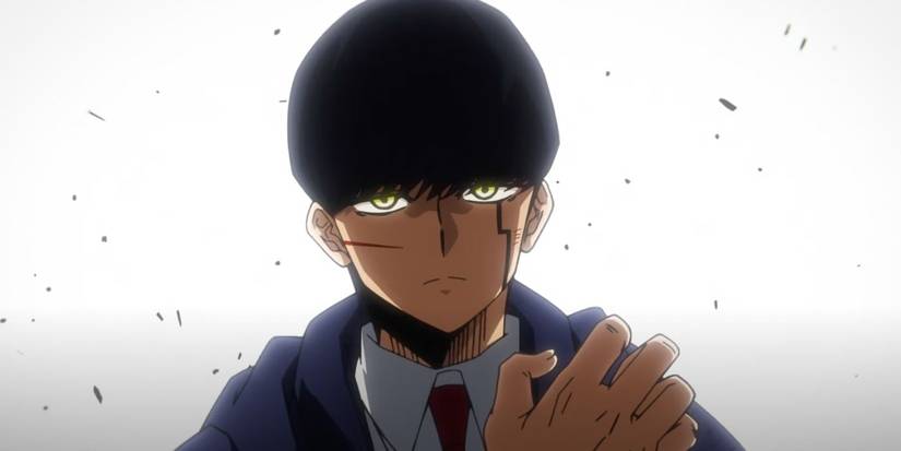 Mash has a dark expression and a cut on his cheek in Mashle: Magic and Muscles.