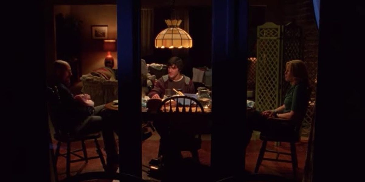 Walter, Flynn, and Skyler having dinner at the table in Breaking Bad