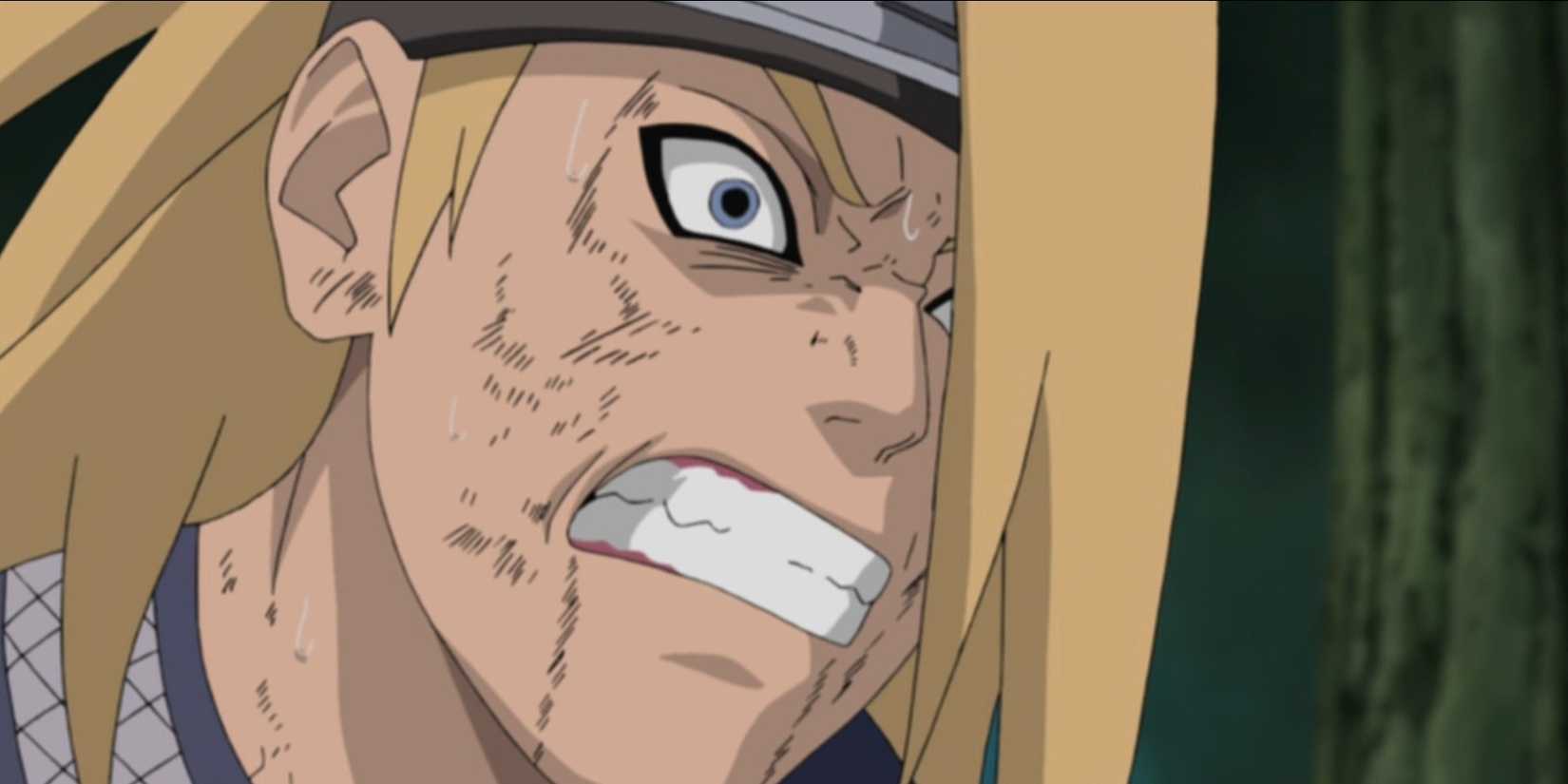 Deidara is baring his teeth in anger in Naruto: Shippuden.