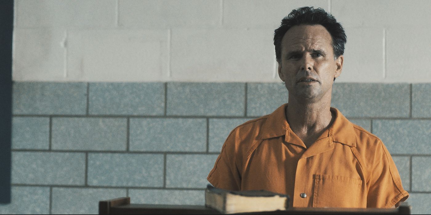 Boyd Crowder, played by Walton Goggins, stands in a prison jumpsuit in Justified: City Primeval