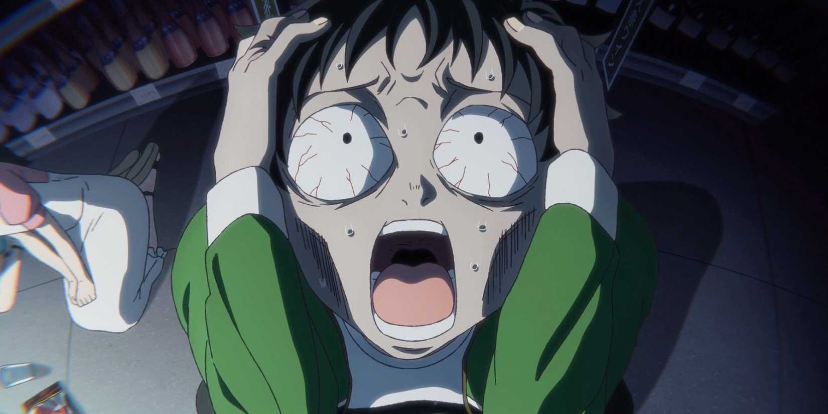 Akira Tendo is grasping his head in horror in Zom 100: Bucket List of the Dead.