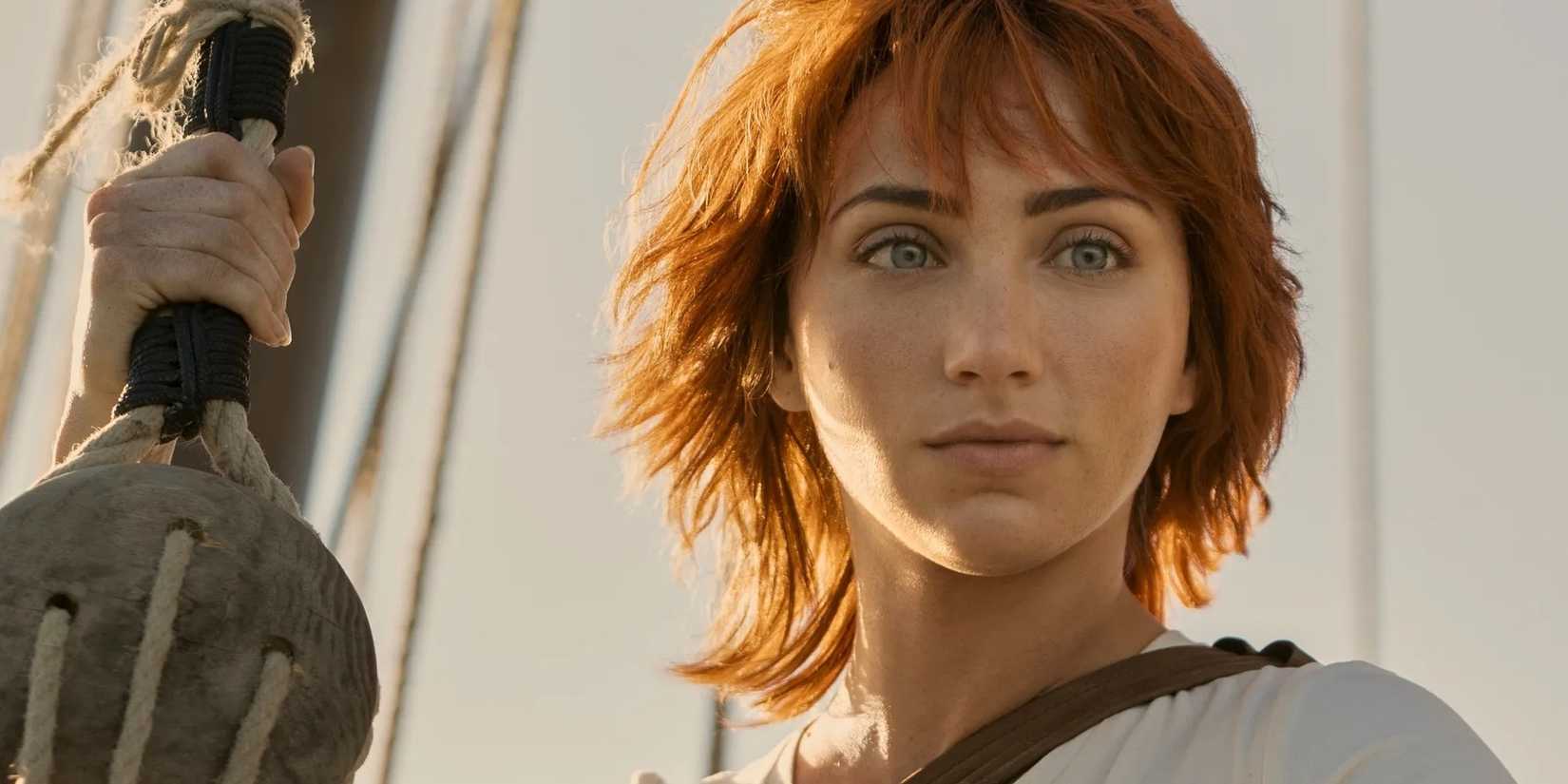 Nami (Emily Rudd), the navigator from One Piece, looks off into the distance.