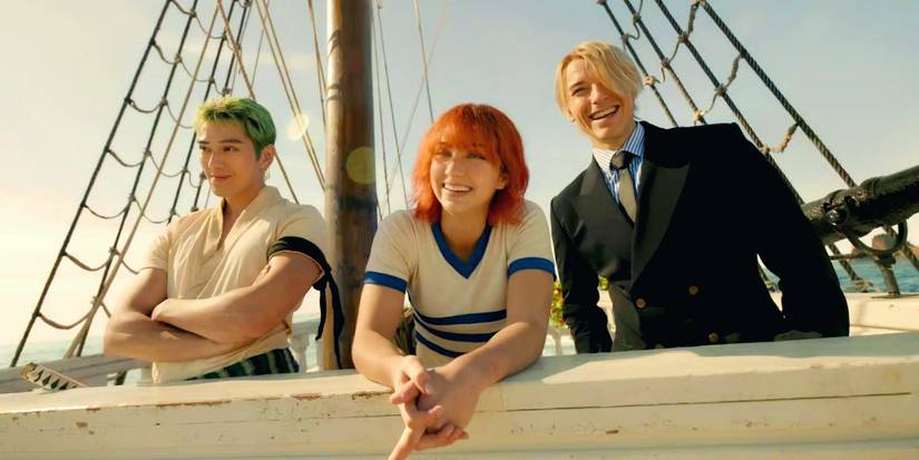 Roronoa Zoro (Mackenyu), Nami (Emily Rudd), and Sanji (Taz Skylar) are smiling in Netflix's live-action One Piece.