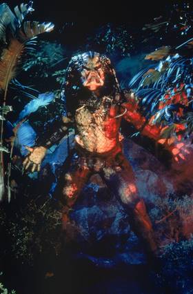 The Predator walks out of the forest ready to attack.