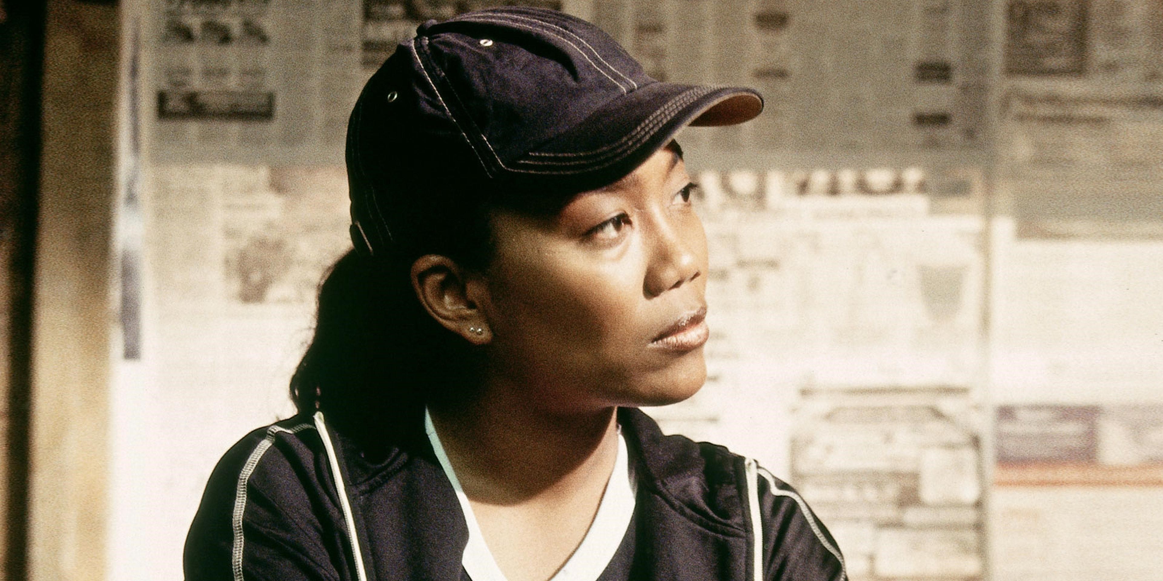 Kima Greggs, played by actress Sonja Sohn, wearing a hat and looking to her side in The Wire