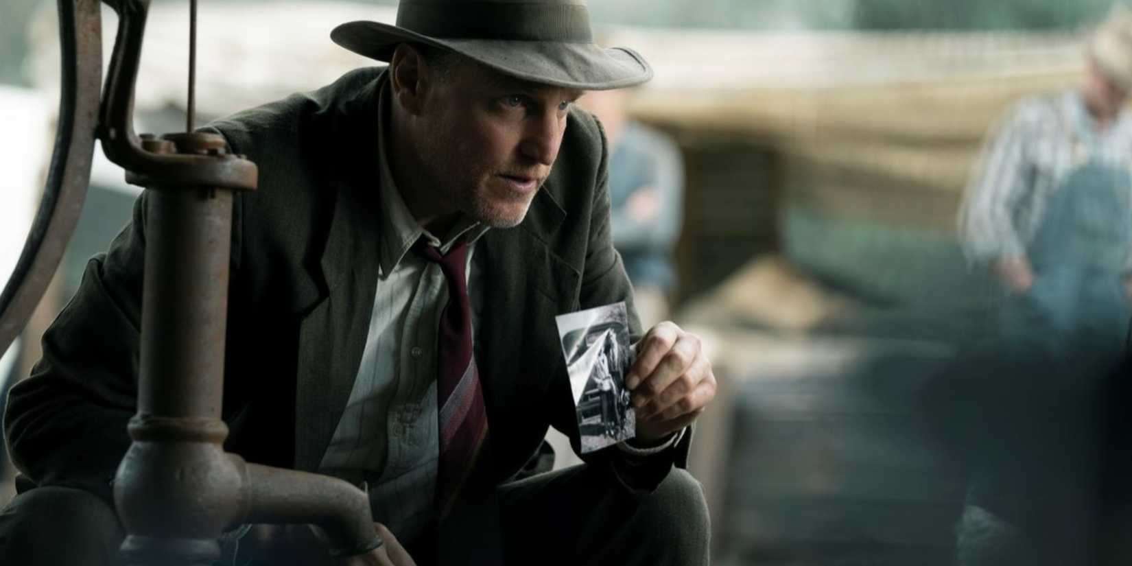 Maney Gault shows someone a photo in 2019's The Highwaymen