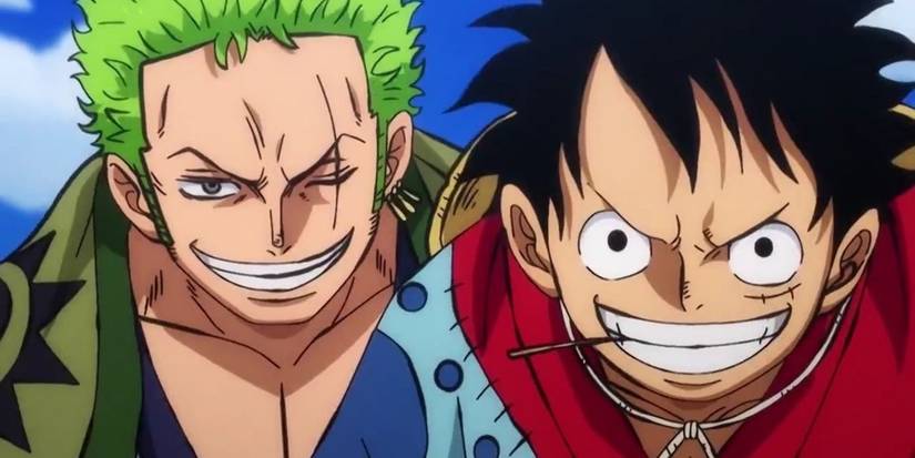 Close-ups of Zoro and Luffy from the One Piece anime grinning at the viewer