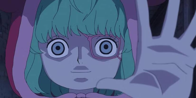 One Piece's Sugar has wide eyes as she holds up one hand.