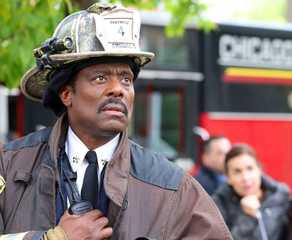 Eamonn Walker stands in front of a fire truck as Wallace Boden on Chicago Fire