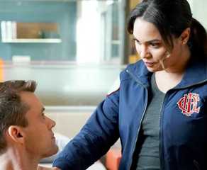 Jesse Spencer as Matthew Casey talks with Monica Raymund as Gabriela Dawson on Chicago Fire