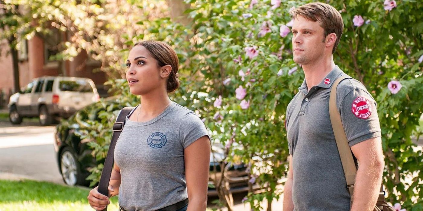 Monica Raymund as Gabriela Dawson stands with Jesse Spencer as Matthew Casey on Chicago Fire