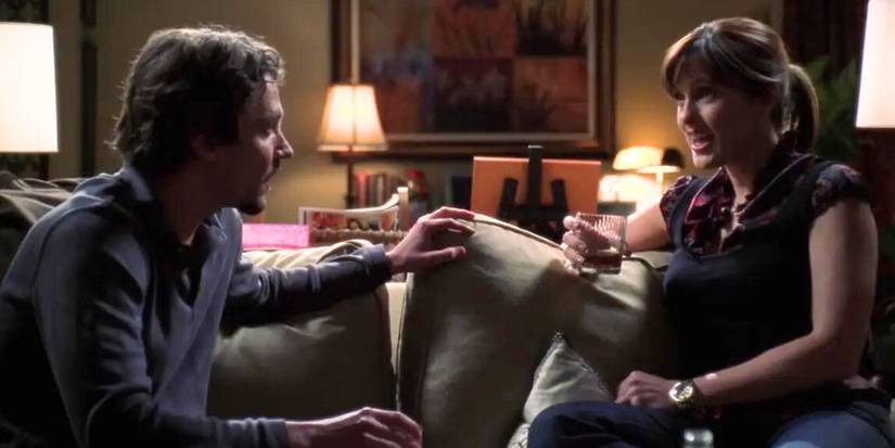 Michael Weston as Simon Marsden sits on a couch with Mariska Hargitay as Olivia Benson in SVU's Philadelphia