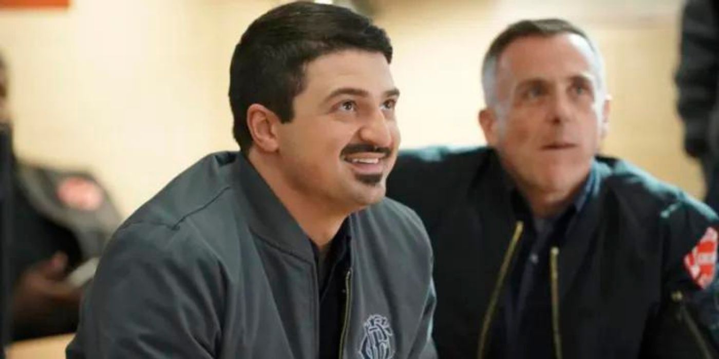 Yuri Sardarov as Brian 'Otis' Zvonecek sits with David Eigenberg as Christopher Herrmann on Chicago Fire