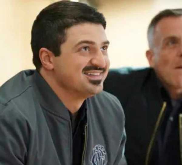 Yuri Sardarov as Brian 'Otis' Zvonecek sits with David Eigenberg as Christopher Herrmann on Chicago Fire