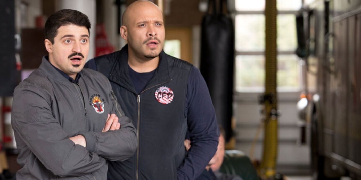 Yuri Sardarov as Brian 'Otis' Zvonecek stands with Joe Minoso as Joe Cruz on Chicago Fire