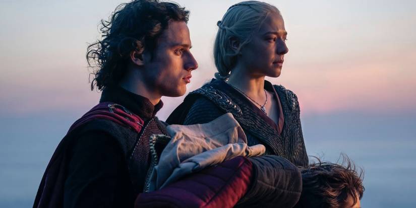 Jacaerys Velaryon holds Lucerys' clothes beside Rhaenyra Targaryen in House of the Dragon.