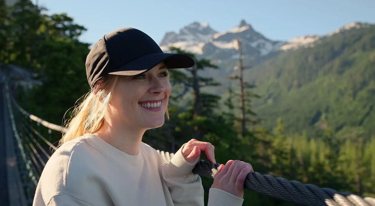 Mel smiles on a bridge in Virgin River