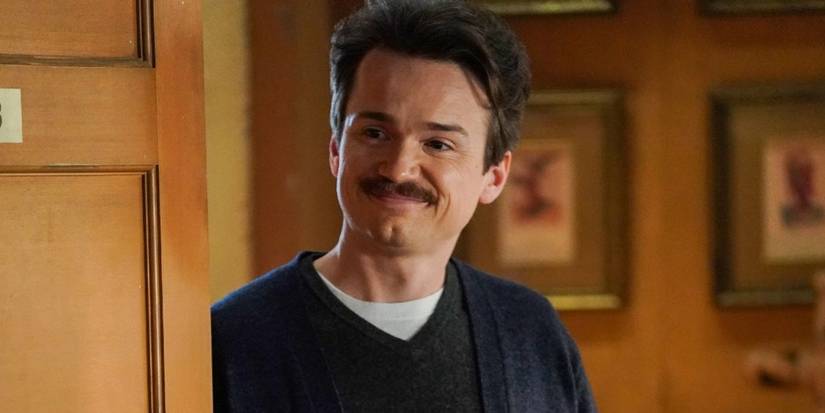Pastor Rob smiling in a doorway in Young Sheldon