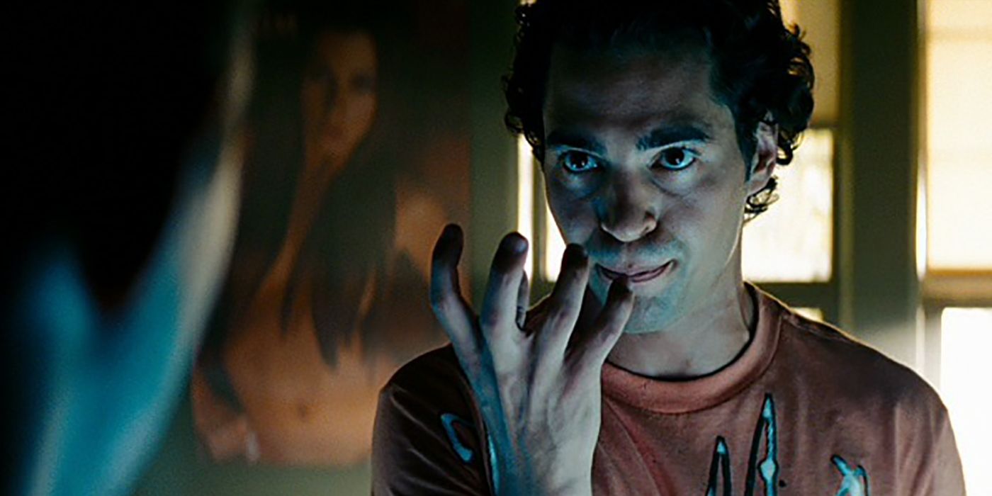 Ramon Rodriguez in the dark with his fingers outstretched in a scene from Transformers: Revenge of the Fallen.