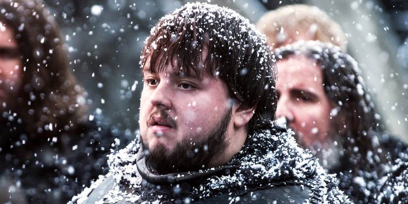 Samwell Tarly stands among men of the Night's Watch in the snow