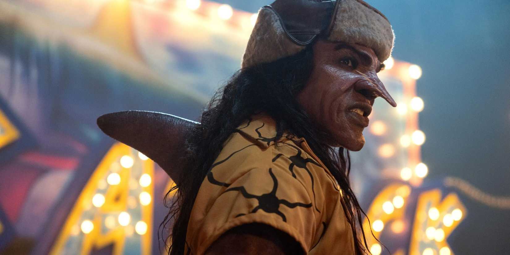 The live-action One Piece villain Arlong (McKinley Belcher III) snarls angrily in Luffy's direction.