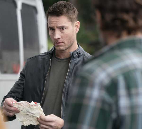 Colter looks at an uncrumpled piece of paper on Tracker.