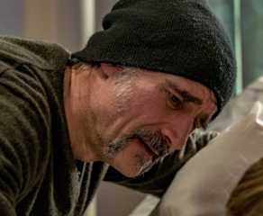 Alvin Olinsky (Elias Koteas) by his daughters hospital bed in Chicago Fire episode "Deathtrap"