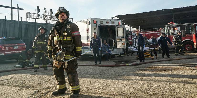 Joe Minoso as Firefighter Joe Cruz with his team looking up at a rescue scene in Chicago Fire episode "My Miracle"