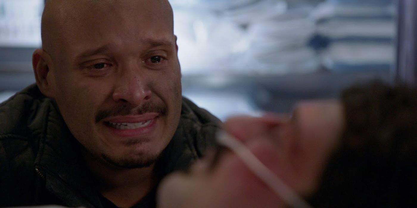 Joe Minoso as Firefighter Joe Cruz at the hospital bed of Yuri Sardarov as Firefighter Brian "Otis" Zvonecek in Chicago Fire in episode "Sacred Ground "