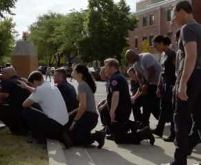 Firehouse 51 kneeling at Brian Zvonecek's memorial in Chicago Fire episode "Sacred Ground"