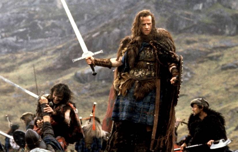 Christopher Lambert posed with a sword in Highlander 