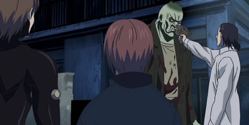 Kato aims his pistol at the Adult Onion Alien in Gantz.