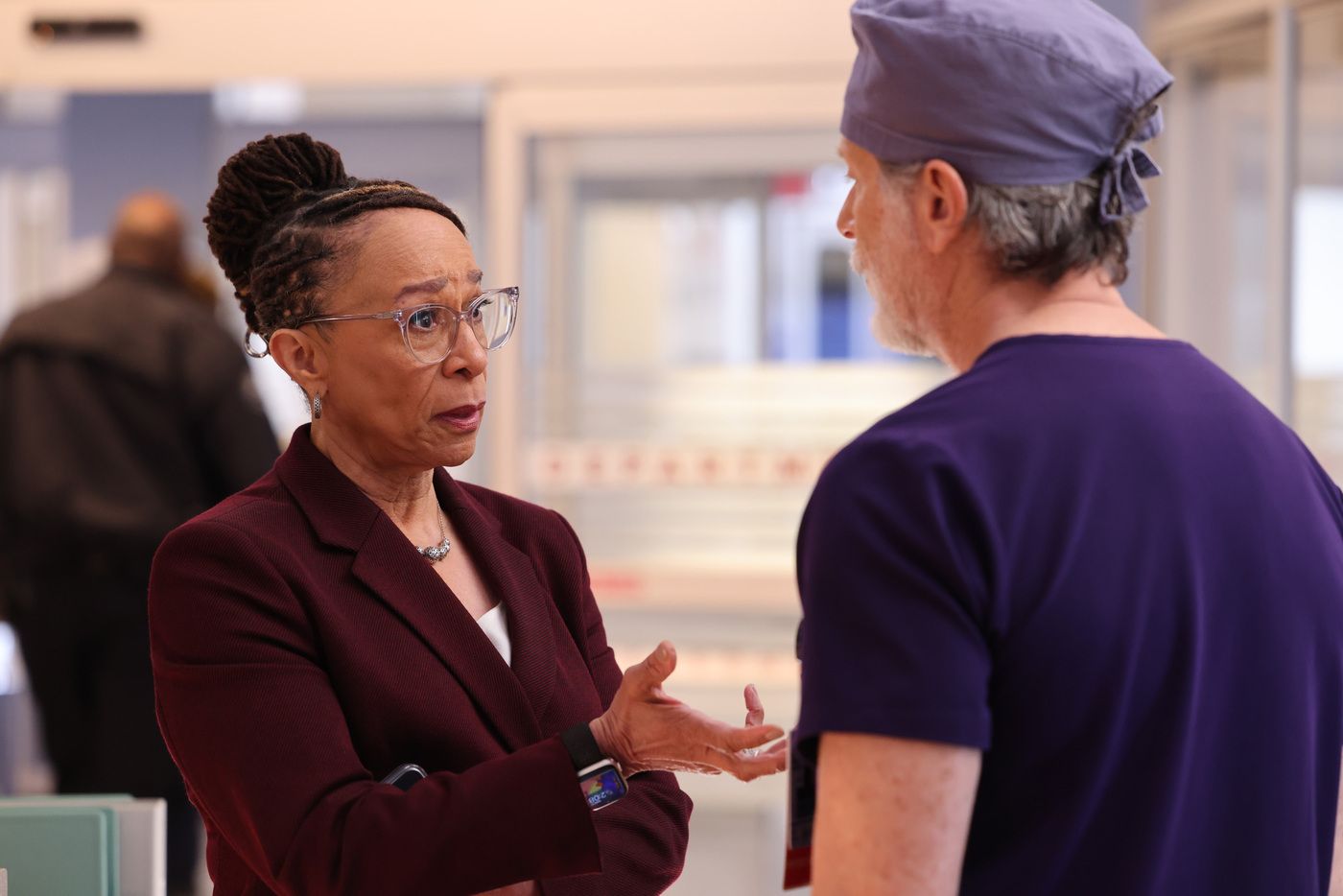 Goodwin (actor S. Epatha Merkerson) in a maroon suit speaking to Archer on Chicago Med
